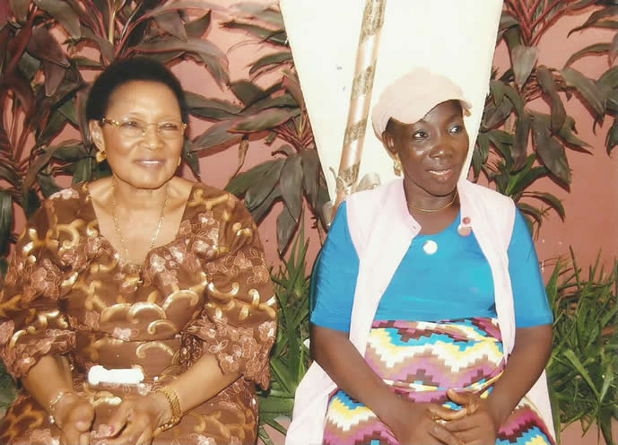 Lady Benedicta seated with a trainee