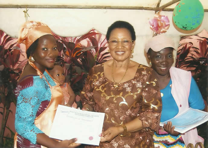 Mother and child receiving a certificate of attendance
