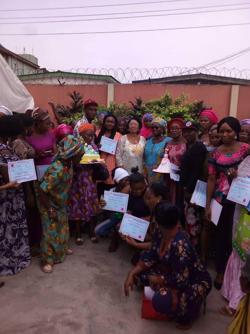 Group photo with cakes at a graduation ceremony