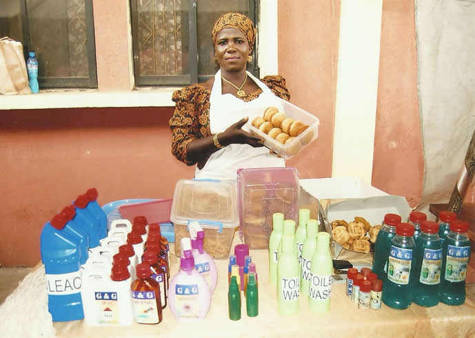 Trainee displaying baked goods and homemade toiletries